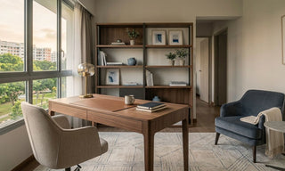 5-room HDB study with wooden desk, open shelving, armchair and large window view.