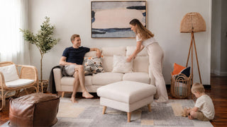 Cream affordable sofa with matching ottoman in a practical Singapore living room for everyday family comfort