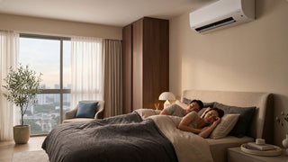 Couple sleeping under an aircon in a warm modern Singapore bedroom with city views