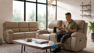 Man using a beige recliner armchair with matching sofa and coffee table in a modern Singapore living room