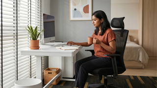 Budget desk chair in a clean Singapore home office with ergonomic work setup