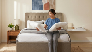 Comfortable pillow on a neatly styled bed in a Singapore bedroom with soft natural light