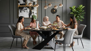 Family sharing a meal around a black dining table set with grey chairs in a modern Singapore dining room