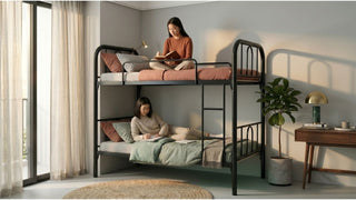 lack metal bunk bed in a bright Singapore bedroom with two teens studying on upper and lower bunks