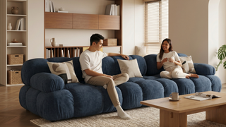 Blue sofa in a modern Singapore living room with warm neutrals and natural wood accents