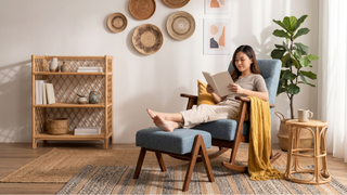 Bohemian living room with fabric sofa, natural rug, coffee table, plants, and warm layered styling