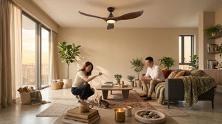 Couple relaxing in a Singapore living room with ceiling fan, sofa, plants, and pet-friendly layout