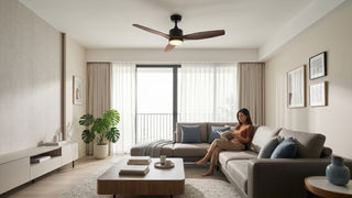 Modern Singapore living room with a ceiling fan with light above a beige sectional sofa and coffee table.