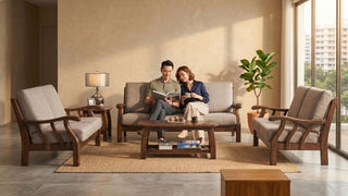 Couple relaxing on a wooden-frame Chinese sofa set in a modern Singapore home
