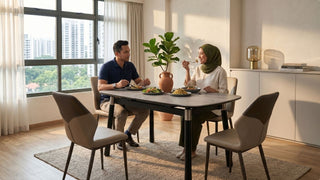 Couple dining at a standard-height table in a bright Singapore HDB dining area