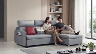 Couple relaxing on a grey L-shaped sofa bed in a bright modern Singapore home
