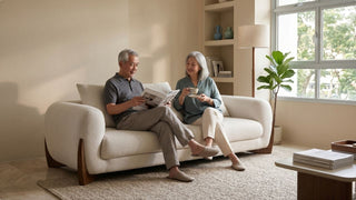 Older couple arranging a comfortable bedroom in a smaller Singapore flat after downsizing