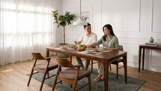 Custom wood dining table styled for everyday meals in a bright Singapore home with wooden chairs