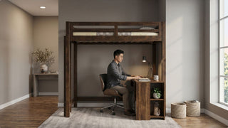 Man using a laptop at a desk under a dark wood loft bed in a modern Singapore bedroom with storage shelves