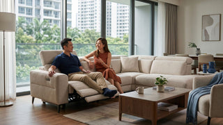 Couple relaxing on a fabric electric recliner sectional sofa in a modern Singapore condominium living room