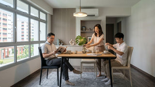 Family using black and cream dining chairs around a wooden dining table in a bright Singapore HDB dining room