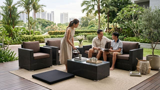 Family using a rattan garden furniture set for outdoor lounging in a Singapore patio garden