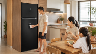 Fridge with ice dispenser in a Singapore kitchen with modern cabinets and family-size storage