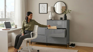 Woman using a grey steel filing cabinet beside a white office desk in a bright Singapore WFH room