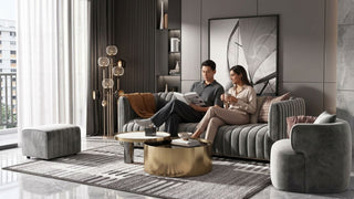 Couple relaxing on a grey velvet sofa in a modern Singapore condo living room