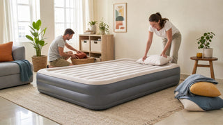 Air mattress set up for guests in a bright Singapore living room with soft bedding and practical storage.