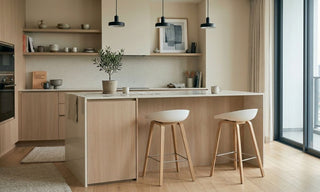 Hay-style bar stools at a modern Singapore kitchen island with light wood cabinetry