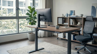 Height adjustable standing desk with ergonomic office chair in a bright Singapore home office