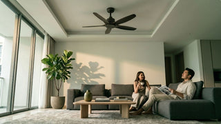 Couple relaxing under a high ceiling fan in a modern Singapore condo living room