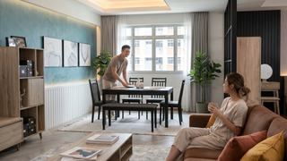 Renovated Singapore living room with sofa, coffee table, and warm modern furniture layout