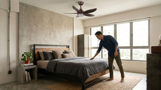 Industrial HDB bedroom with ceiling fan, concrete feature wall, timber metal bed frame and cosy neutral bedding