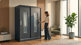 Woman using a large sliding wardrobe cabinet in a spacious condo bedroom with warm wood accents