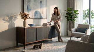 Fluted living room cabinet in a Singapore apartment with warm wood finish, neutral seating, and pet-friendly styling.