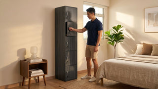 Man unlocking a dark locker cabinet in a warm Singapore bedroom with compact storage