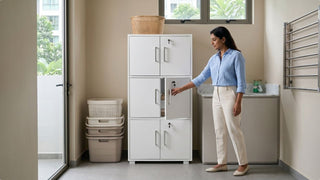 Tall white plastic cabinet with lockable doors in a bathroom utility space for towels, baskets, and household storage