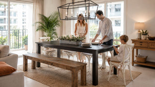 Long wood dining table with bench and chairs in a bright Singapore condo dining area for family mealtime preparation.