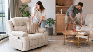 Beige 1 seater recliner sofa in a bright modern Singapore living room with a couple arranging the space