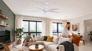 White Acorn ceiling fan in a bright Singapore family living room with a modern sofa, warm decor, and practical everyday home styling.