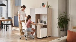 Adjustable study table in a modern Singapore home with a parent helping a child study