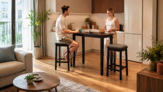 Modern bar table and grey cushioned bar stools in a compact Singapore kitchen dining area