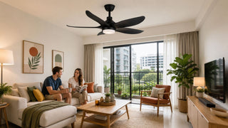 Black ceiling fan with light in a modern Singapore condo living room styled with warm, family-friendly MegaFurniture accents.