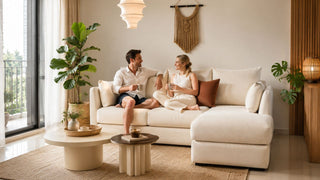 Cream sectional sofa in a modern Singapore living room with a relaxed couple enjoying a practical home setting