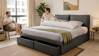 Grey storage bed with body pillow in a modern Singapore bedroom styled for practical everyday comfort