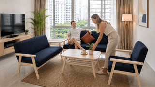Navy fabric sofa set with light wood frame in a modern Singapore BTO living room with compact layout planning