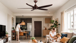 Bronze ceiling fan in a bright Singapore living room with a family relaxing in a modern HDB-style home