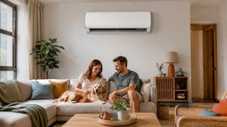 White wall-mounted aircon above a beige sofa in a warm modern Singapore living room for MegaFurniture’s centralised aircon guide
