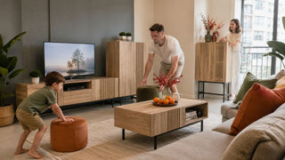 Family arranging extra stools around a modern wooden living room furniture set in a Singapore home for Chinese New Year guests.