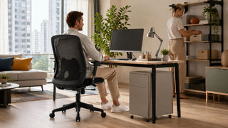 Comfortable black mesh office chair in a modern Singapore home office with a neat desk and practical storage