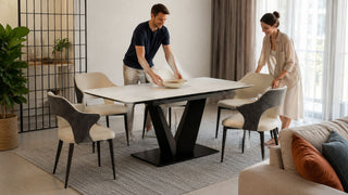 Extendable dining table in a modern Singapore home with a couple preparing the dining area for guests.