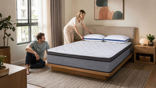 White quilted custom mattress with blue-trim pillows in a modern Singapore bedroom styled for practical comfort.