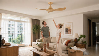 Light wood ceiling fan being checked in a modern Singapore living room after delivery